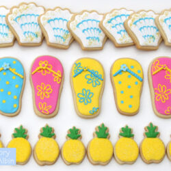 sugar cookies topped with different colors of icing