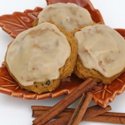 pumpkin cookies with maple icing on leaf plate