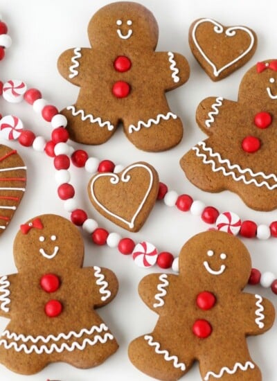 decorated gingerbread cookies with red garland