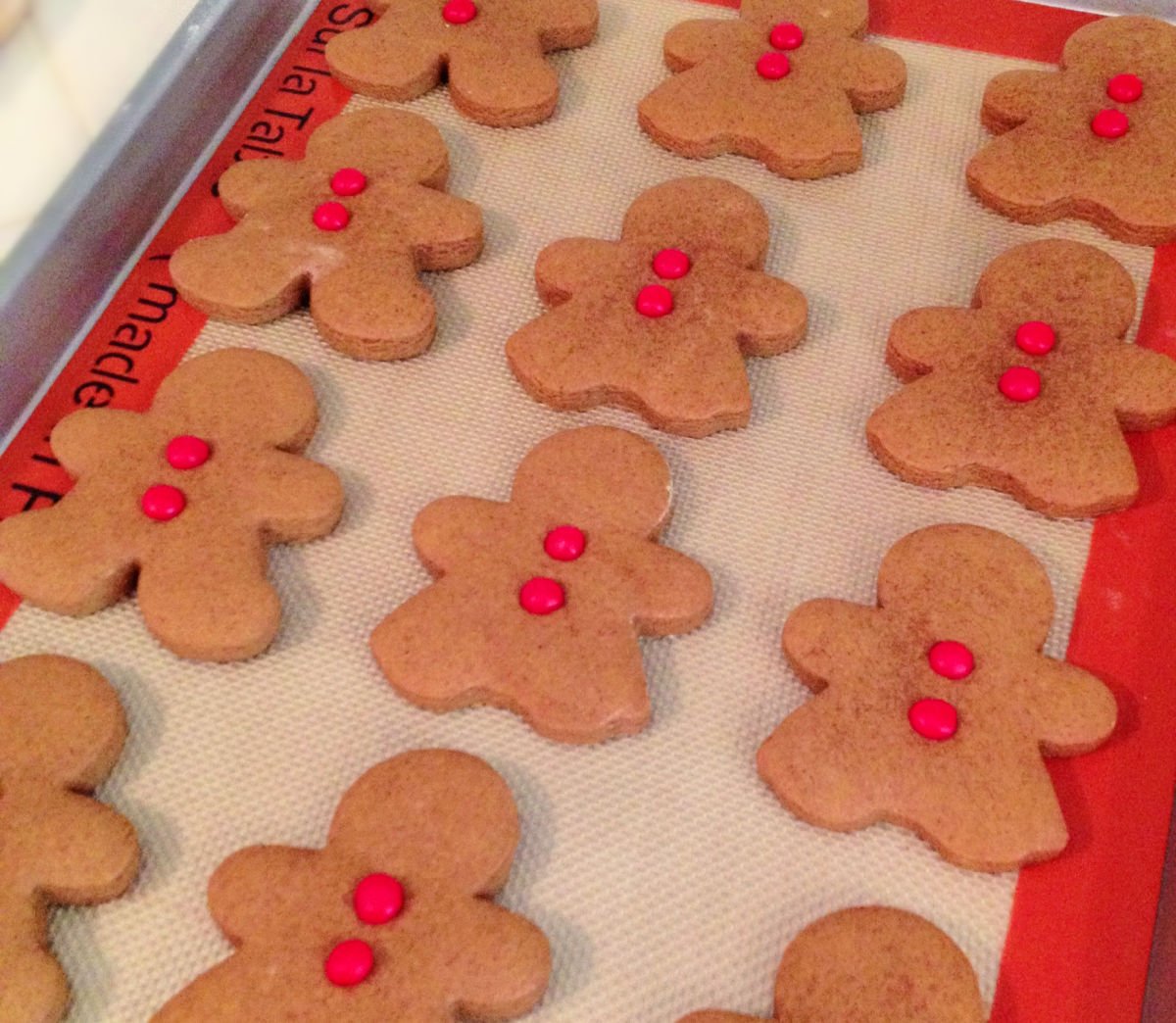 gingerbread cookies ready to be baked on baking sheet