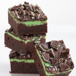 fudge mint brownies stacked on a plate
