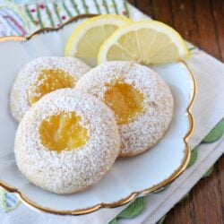 lemon cookies with lemon curd center on white plate