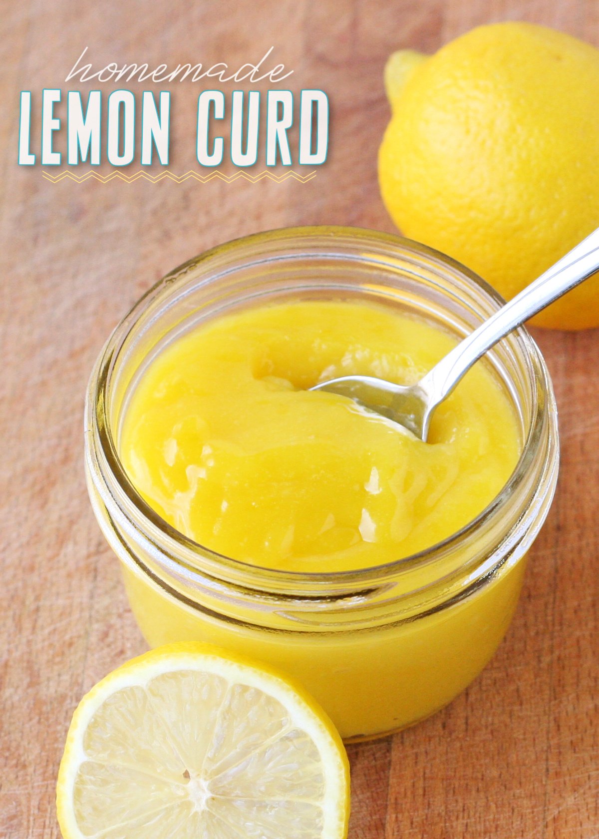 hoememade lemon curd in small glass jar with fresh lemon slices and spoon in jar title overlay