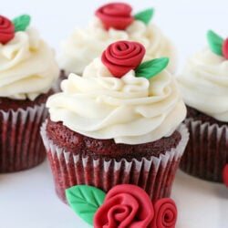 easy red velvet cupcakes with cream cheese frosting thre cupcakes on white background square