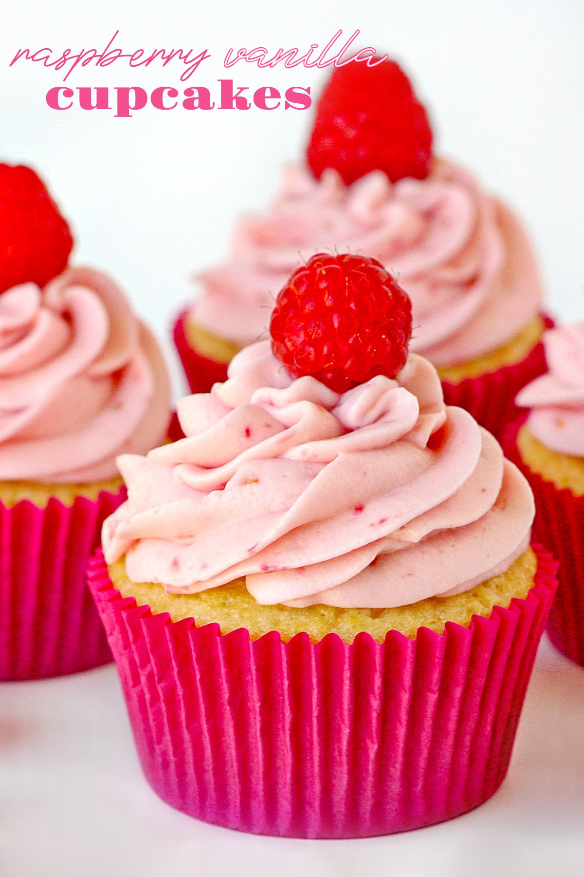 raspberry vanilla cupcakes with raspberry cream cheese frosting in pink cupcake liner with title overlay