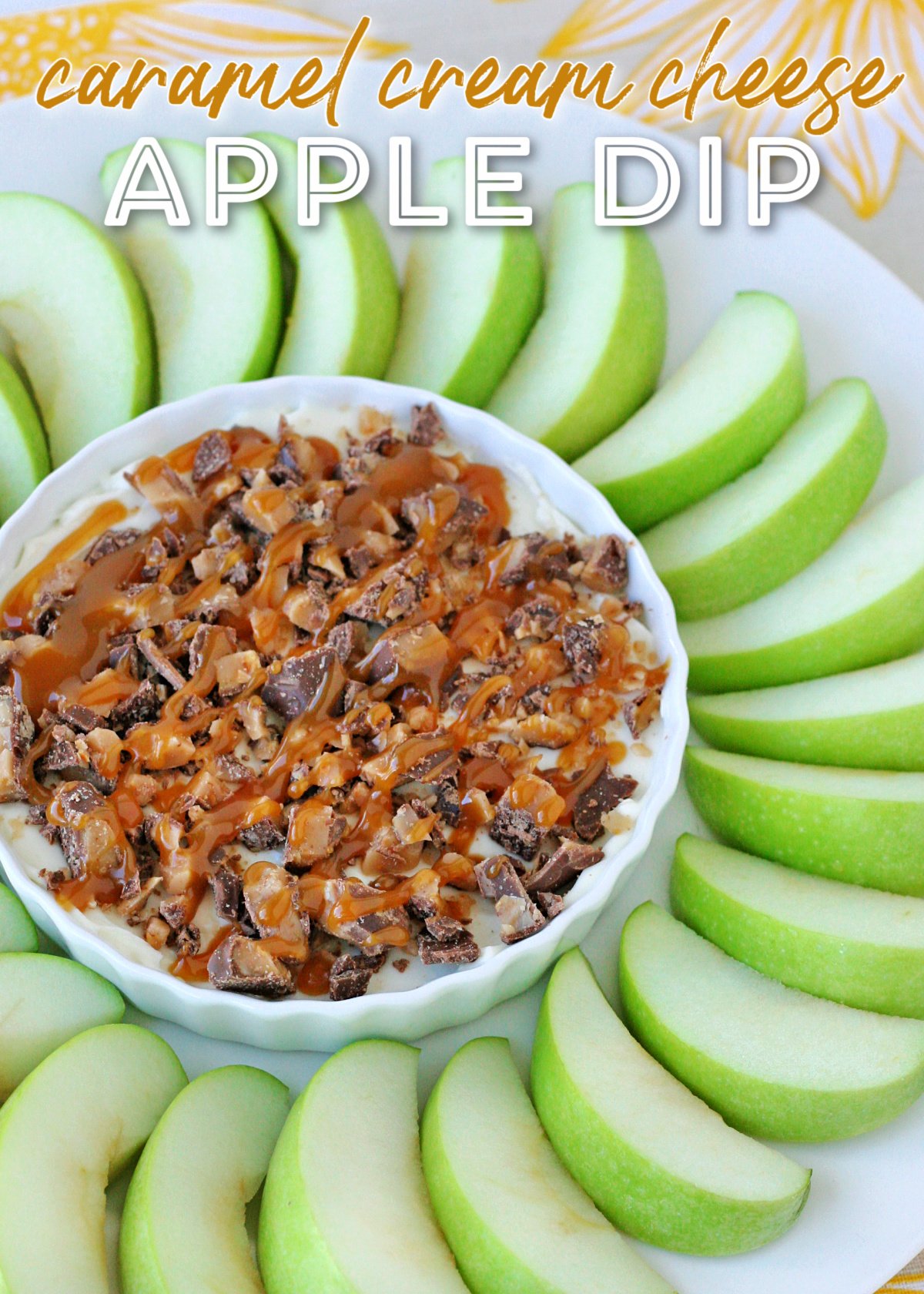 caramel apple dip in white bowl with green apple slices surrounding the bowl with title overlay at top of image.