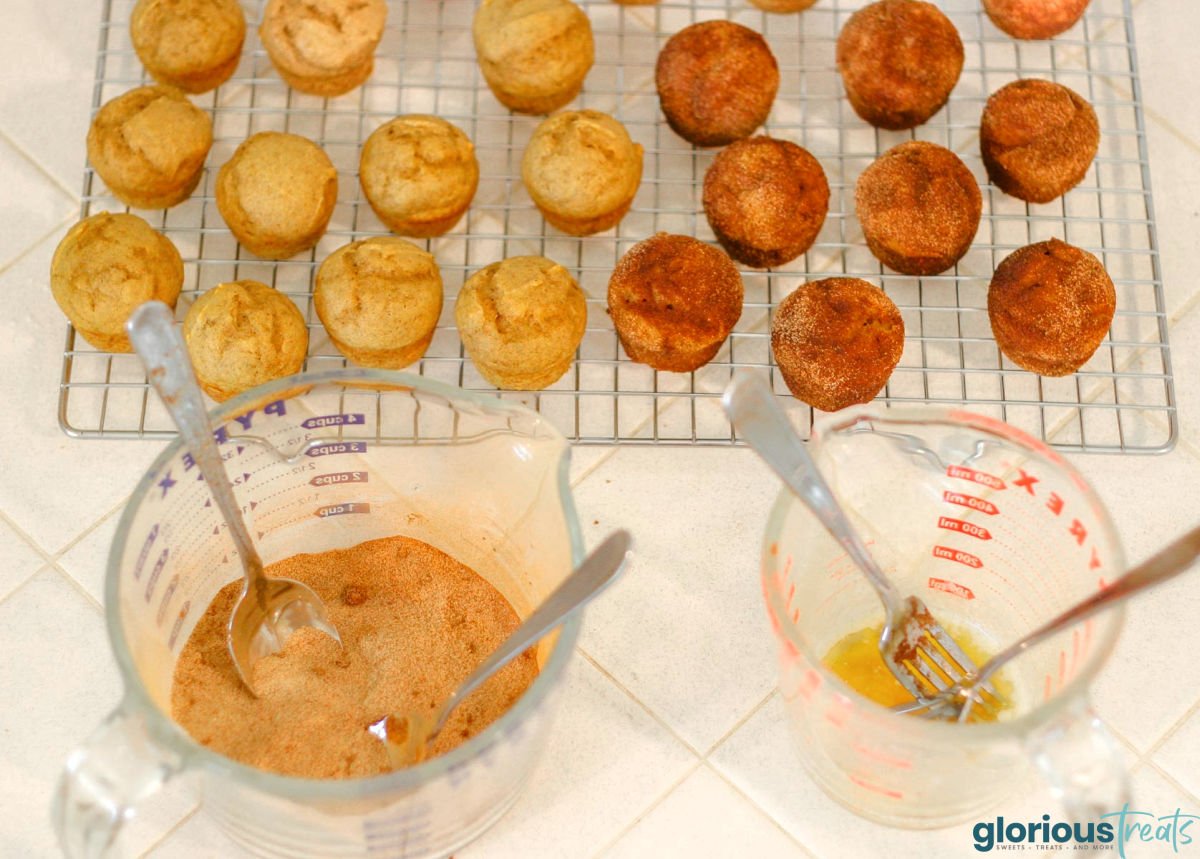 mini muffins are being dipped in melted butter and rolled in cinnamon sugar.