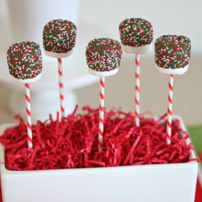 marshmallows covered in chocolate on sticks