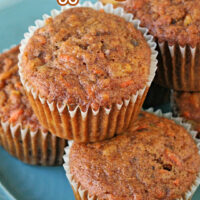 six morning glory muffins on a light blue plate with title at top of image.