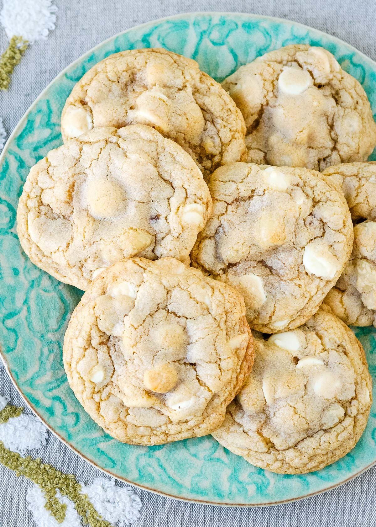 seven cookies on a light green plate top down view