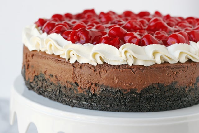 Chocolate Cheesecake with Whippped Cream and Cherries... yum!! - by glorioustreats.com