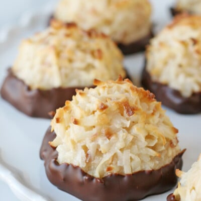 Coconut Macaroons on a white cake stand.
