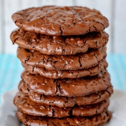 flourless chocolate cookies stacked tall on white plate square image