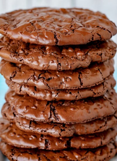 flourless chocolate cookies stacked tall on white plate square image