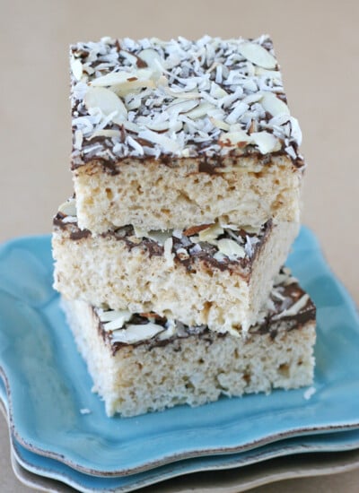 Almond Joy Krispie Treats stacked on a blue plate. - Yes, they are as amazing as they sound!!