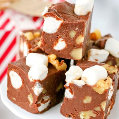 stack of rocky road fudge on white pedestal close up look
