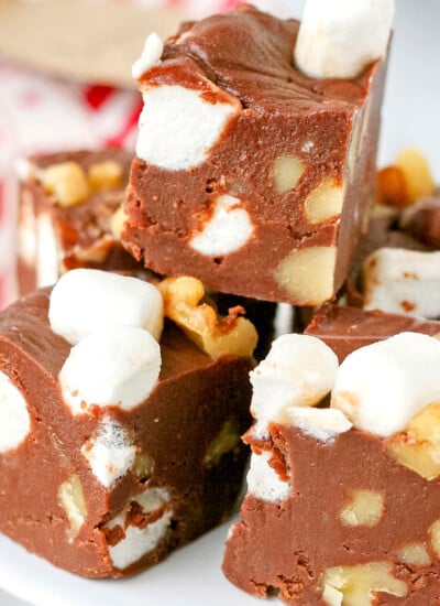 stack of rocky road fudge on white pedestal close up look