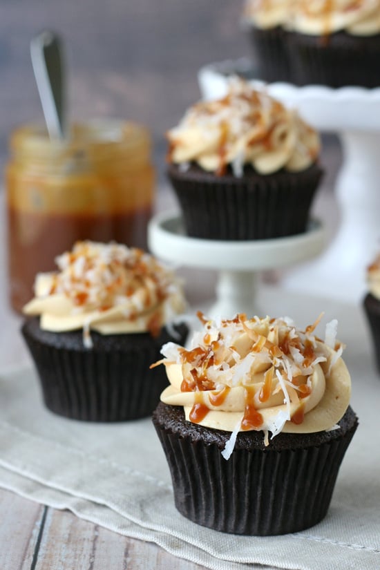 These Samoa cupcakes are so INCREDIBLY good! Chocolate cupcakes are topped with salted caramel buttercream and toasted coconut... amazing! 