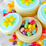 jelly belly cookie boxes made out of sugar cookies and filled with jelly beans. The top to one of the boxes is off so you can see the jelly beans inside.