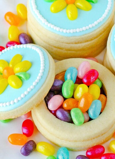 jelly belly cookie boxes made out of sugar cookies and filled with jelly beans. The top to one of the boxes is off so you can see the jelly beans inside.