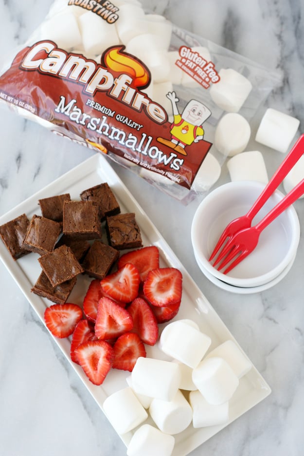 Create the best s'mores treat ever with rich brownie bites, fresh strawberries and roasted marshmallows... YUM! 