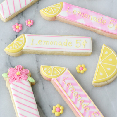 These adorable Lemonade Cookie Sticks are perfect for a lemonade stand or lemon themed party!