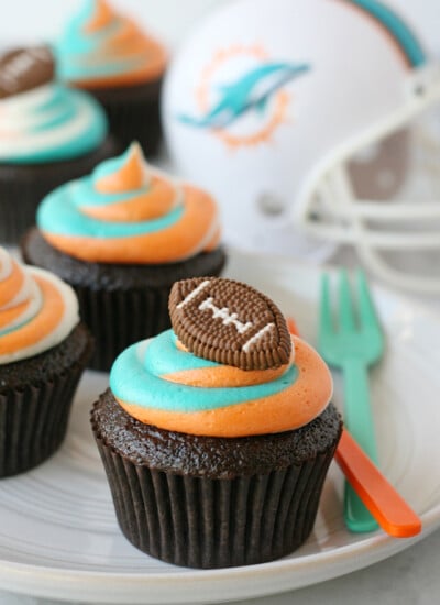 Impressive tri-color frosting for custom football fan cupcakes!