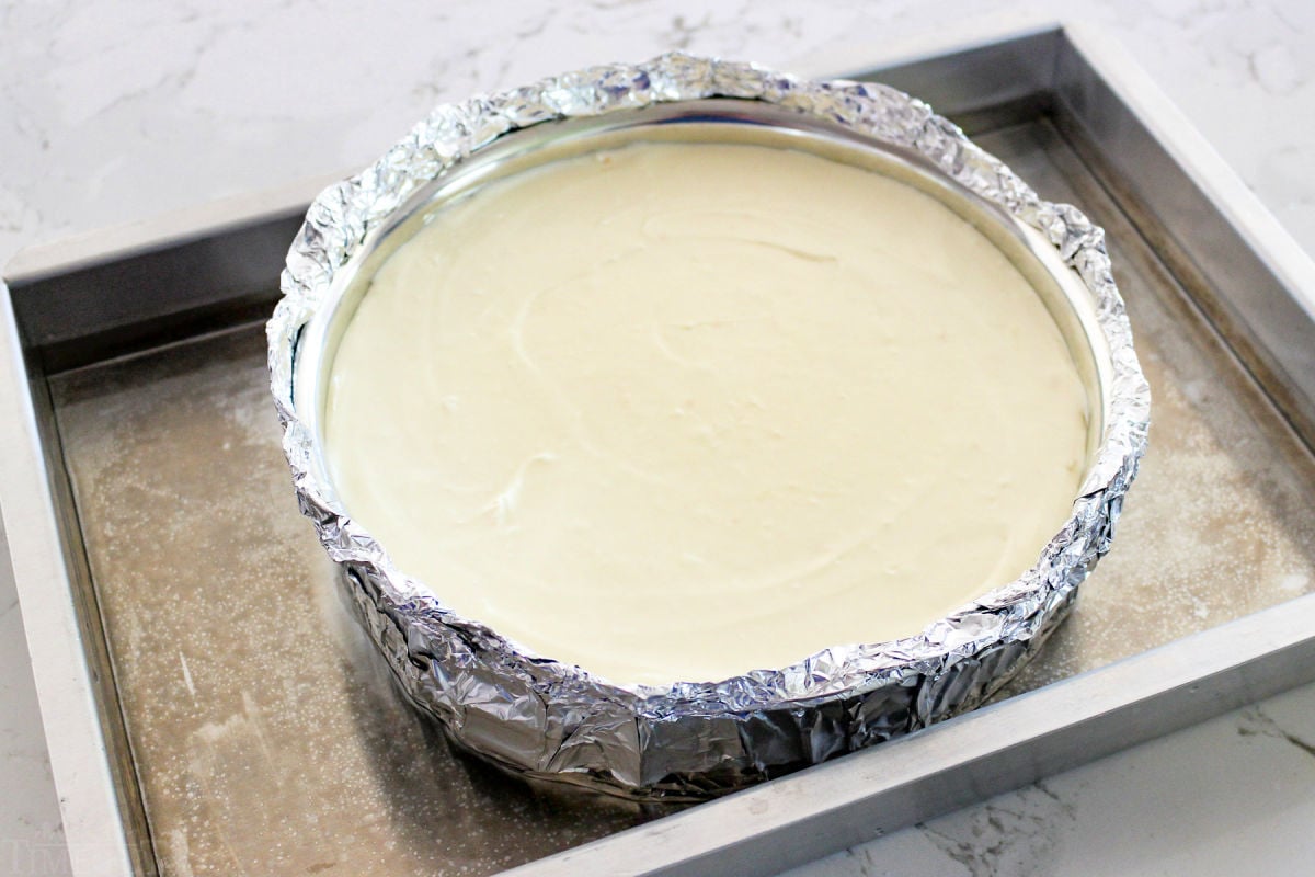 cheesecake in a water bath ready to go in the oven