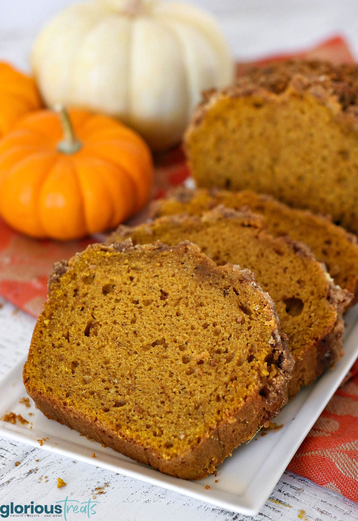 Slices of pumpkin bread on white tray ready to be enjoyed.