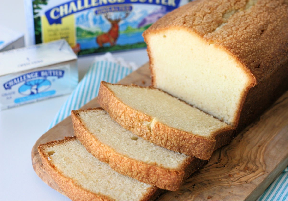 pound cake sliced on wood board.