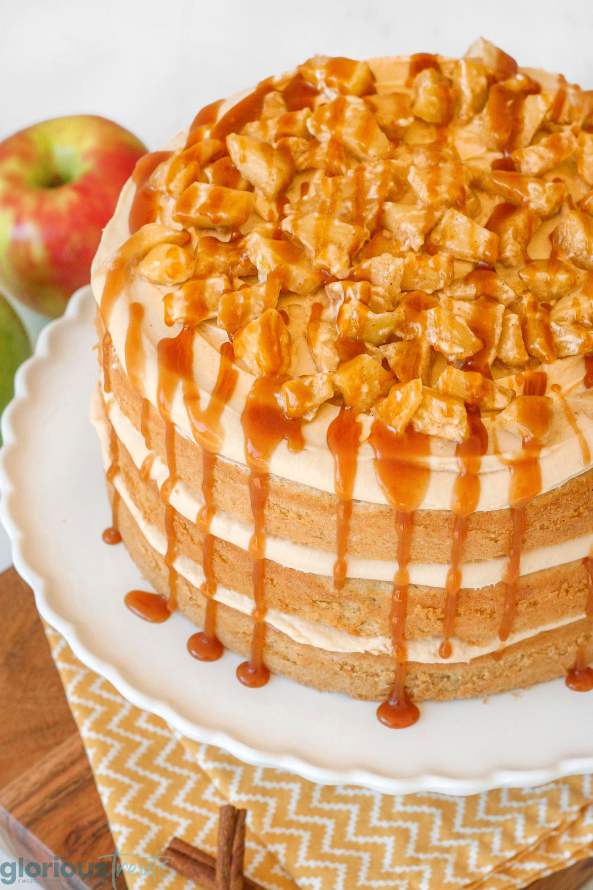Overhead angled shot of spiced apple and caramel sauce on top of the caramel apple cake recipe.
