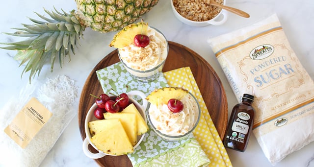 Pina Colada Cheesecake Mousse with napkins and ingredients top down view