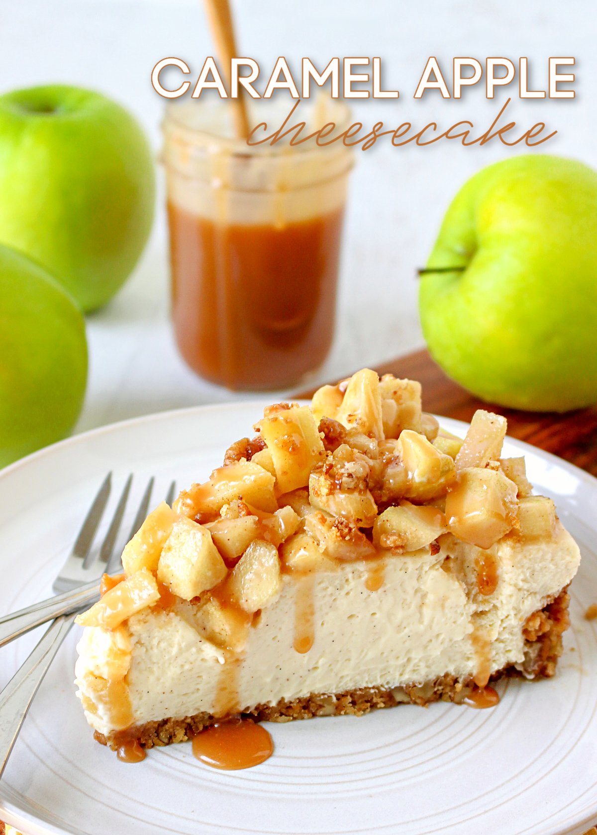 caramel apple cheesecake slice on white plate with green apples and caramel sauce in background title overlay at top