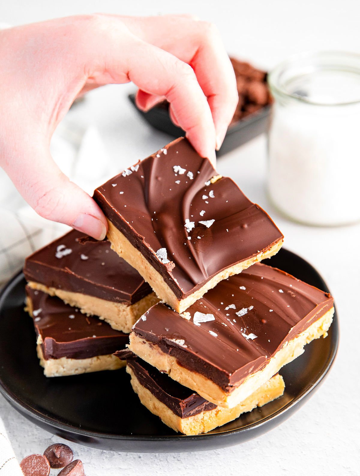 peanut butter bar being picked up off a plate.