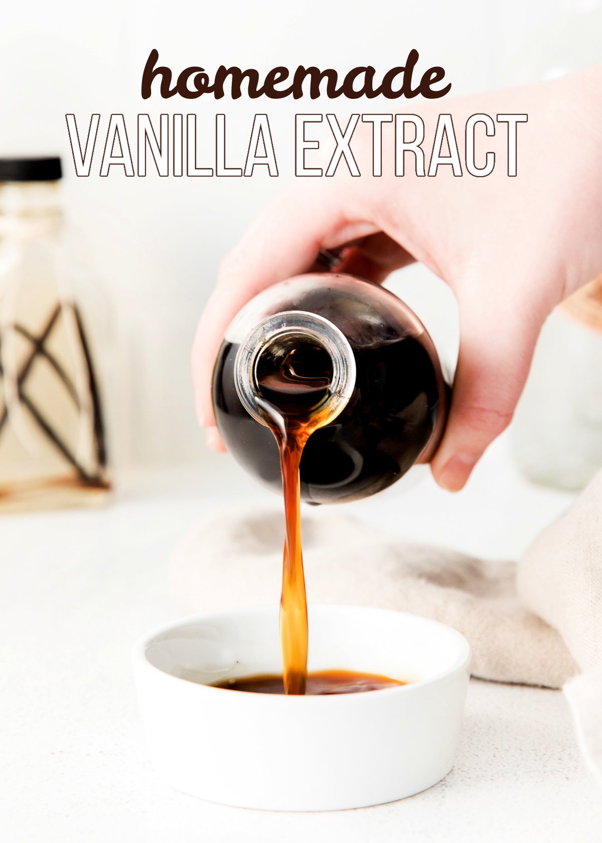 vanilla extract being poured from a bottle into a small white bowl with title overlay at top of image.