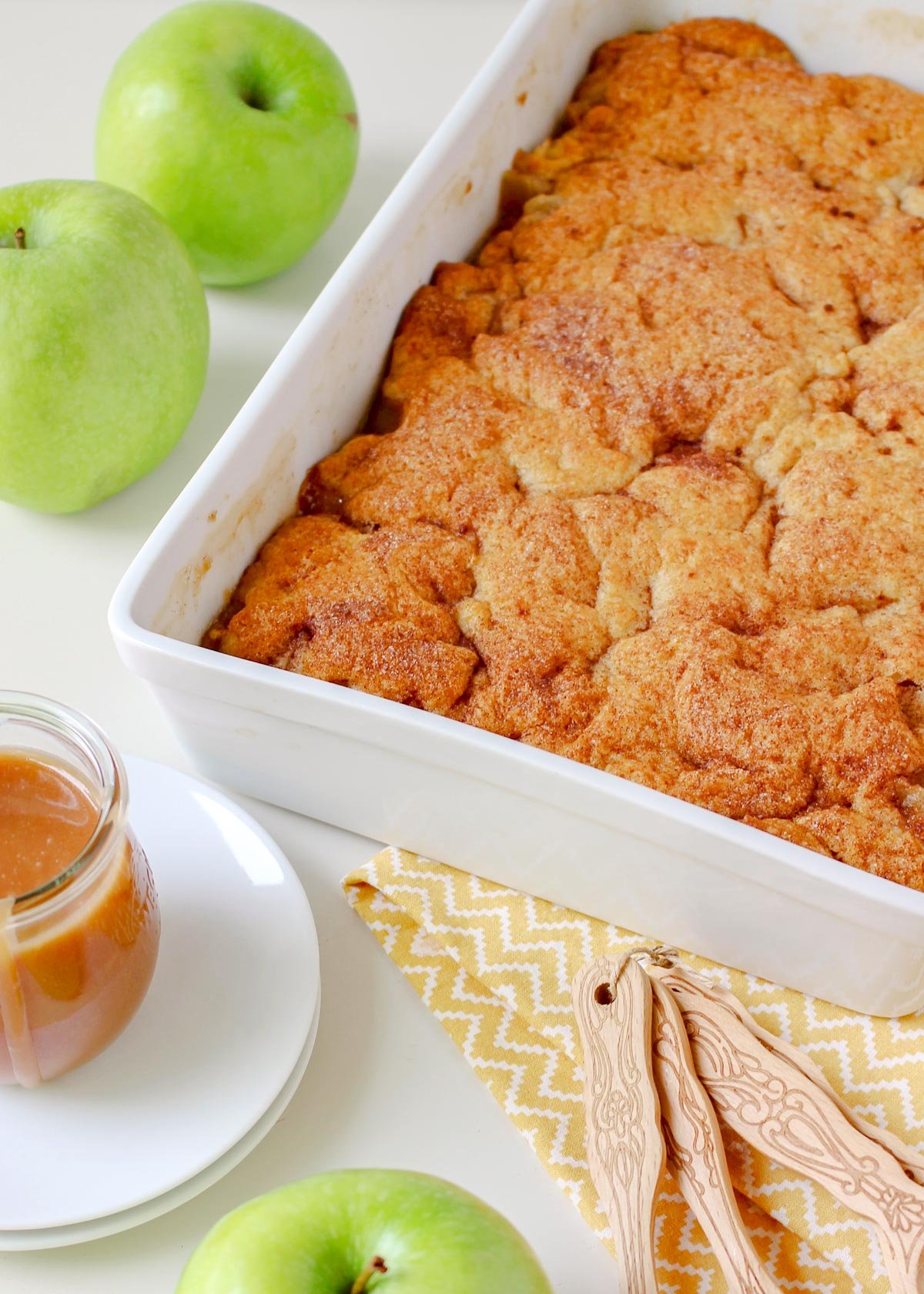 close up of apple cobbler topping in baking dish.