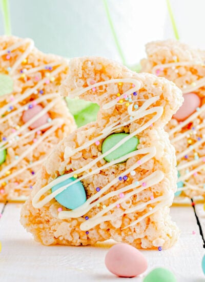 three rice krsipie treats cut into bunny shapes with cadbury chocolate eggs mixed in.