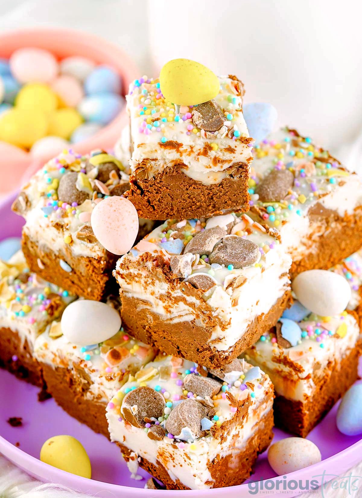 a stack of fudge on a purple plate made with cadbury mini eggs and cadbury ceme eggs.