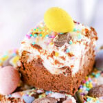 close up look at easter fudge made with cadbury creme eggs stacked on a plate.