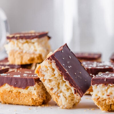 A chocolate coconut bar resting against another.