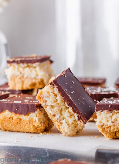 A chocolate coconut bar resting against another.
