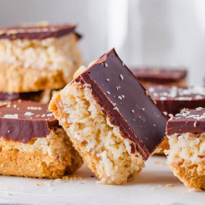 A chocolate coconut bar resting against another.