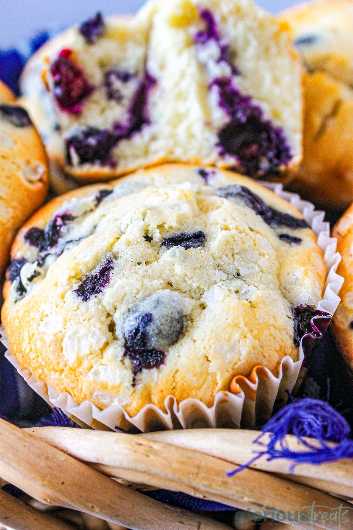A close up shot of a blueberry muffin.