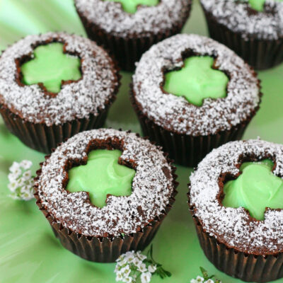 Shamrock Cut Out Cupcakes with mint green frosting in the shape of a shamrock.