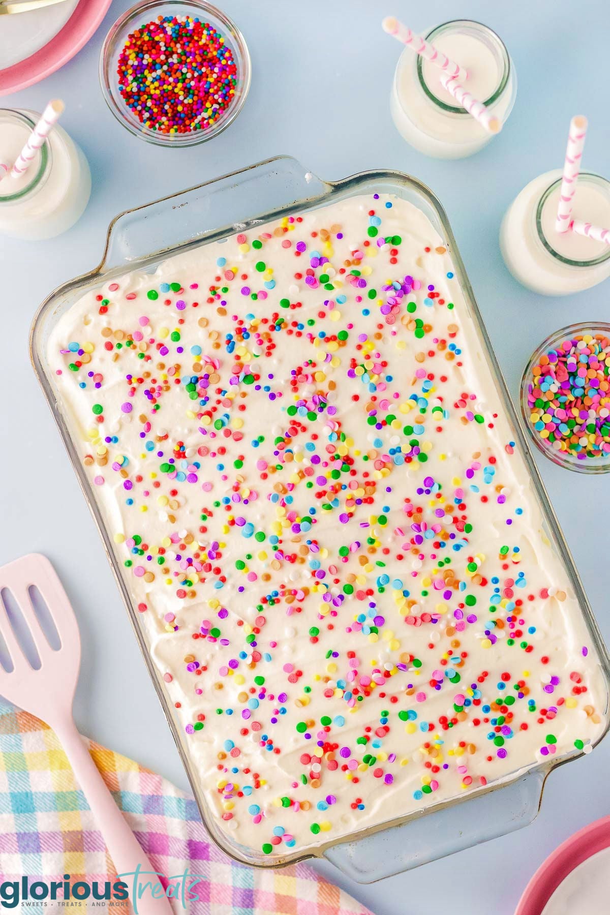 Overhead shot of no bake funfetti lush in glass dish ready to be served.